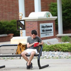 Student Studying Outside Gamble Hall