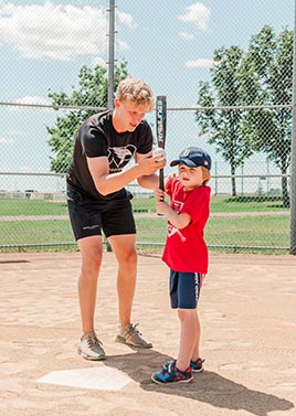 Schaffner coaching tball player